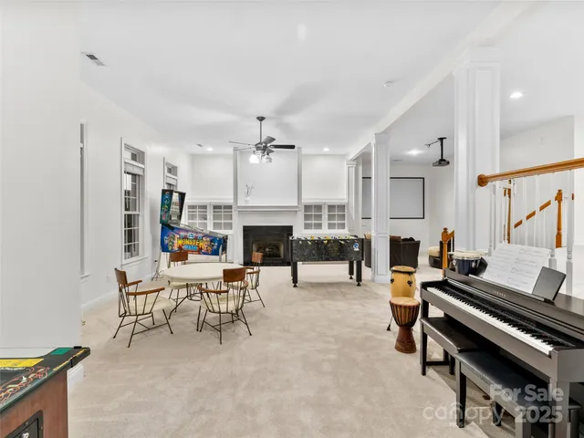 a living room with a fireplace and a rug