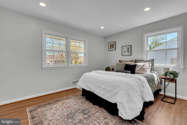 a bed room with a bed and a window