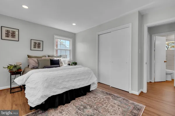 a bed room with a bed and a window