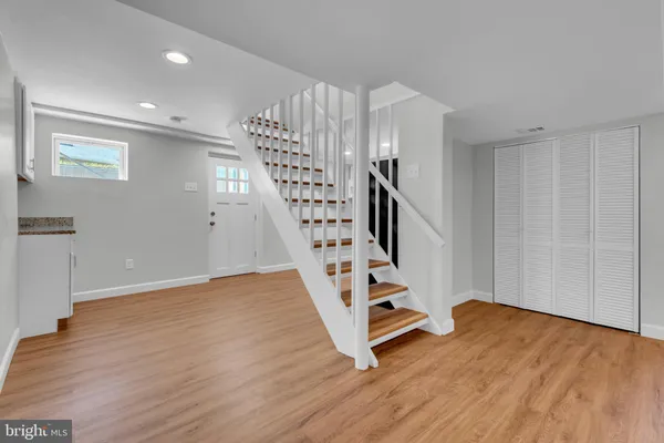 a view of entryway with wooden floor