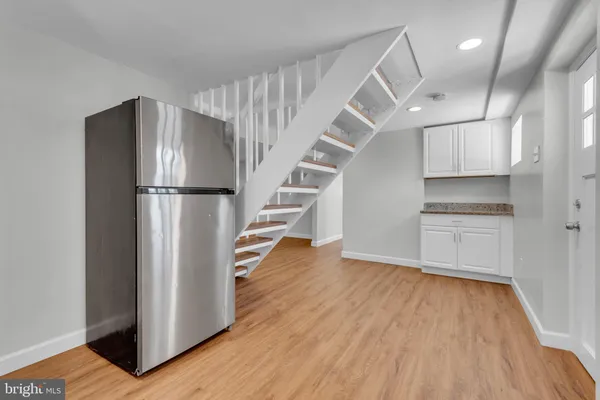 a view of kitchen and wooden floor