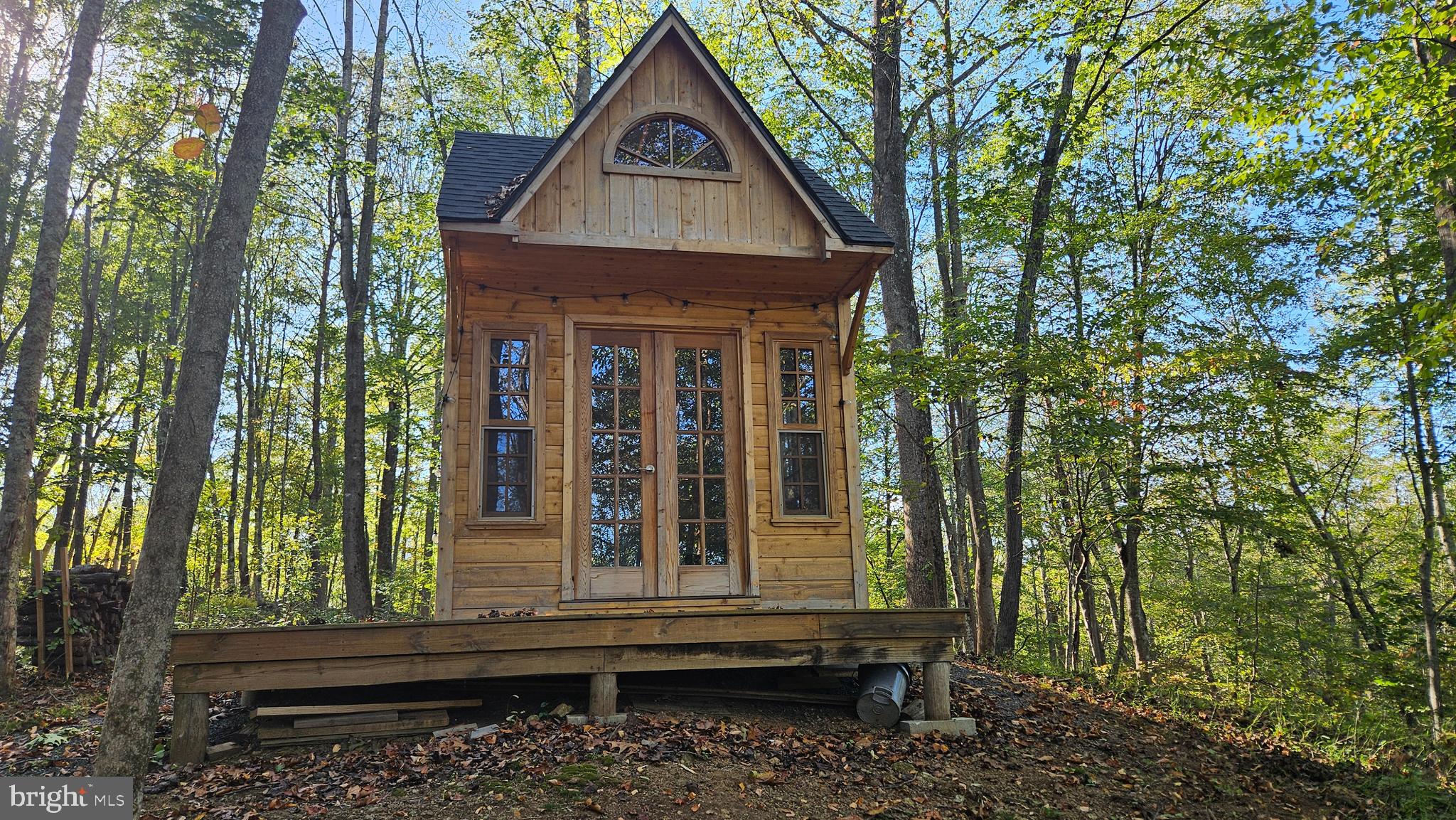 0 Sharp Rock Road Sperryville, VA 22740 - Photo 18 of 31 a front view of a house with garden