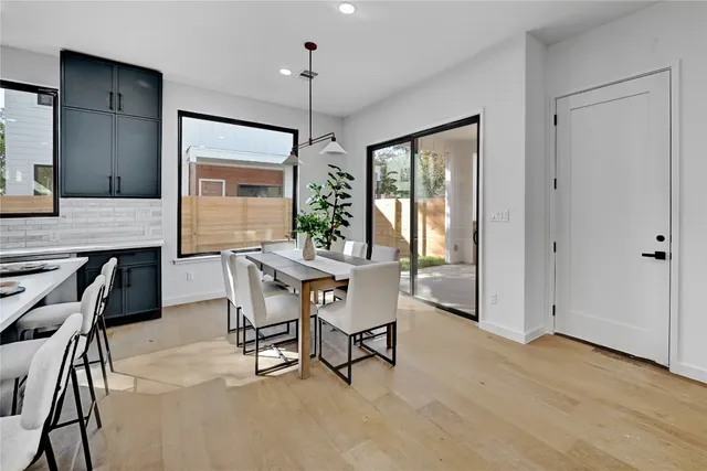 a view of a dining room with furniture and window