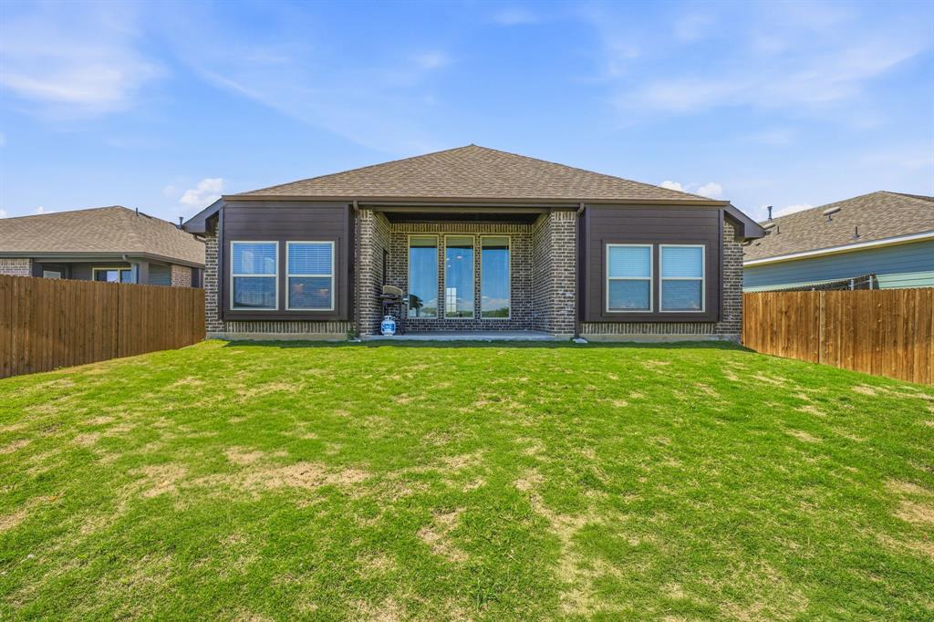 800 Jaguar Ridge Godley, TX 76044 - Photo 20 of 23 a front view of a house with garden
