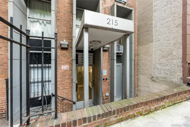 a view of a brick house with a large door