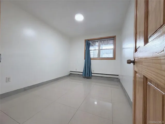 an empty room with a fireplace