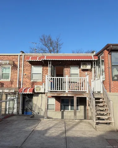 a view of a patio with table and chairs