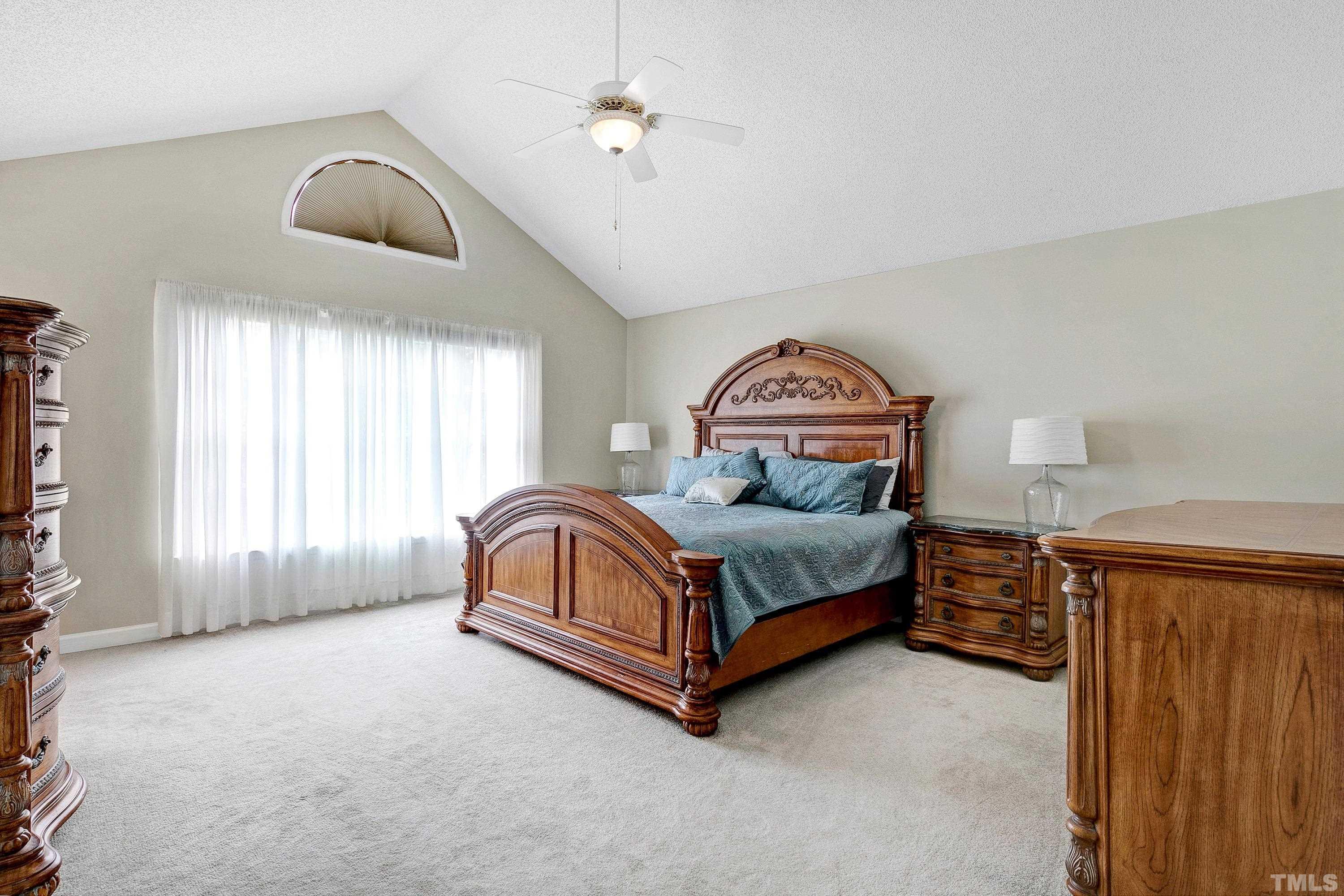 117 Trailing Oak Cary, NC 27513 - Photo 14 of 32 a bedroom with a bed closet and window