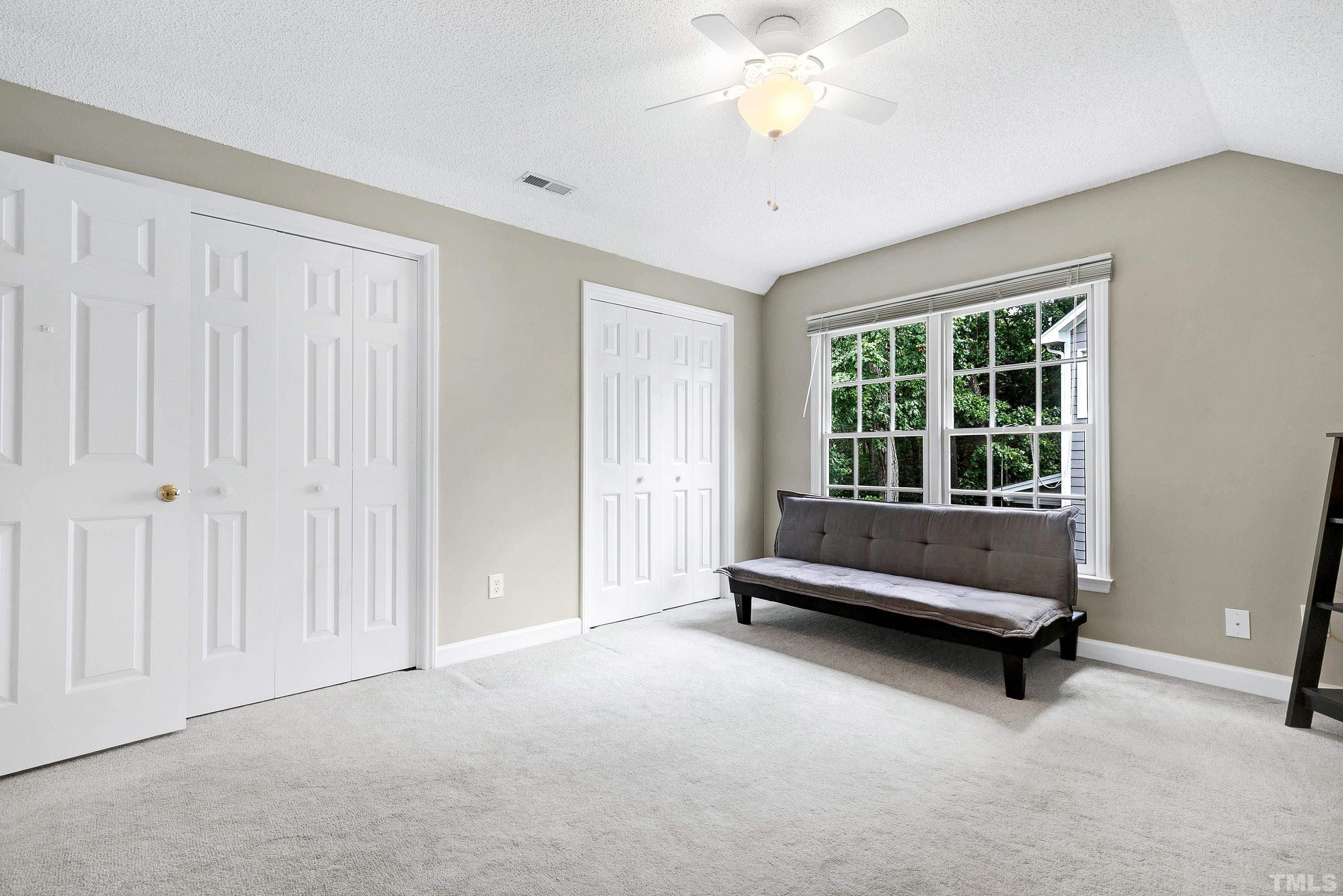 117 Trailing Oak Cary, NC 27513 - Photo 22 of 32 a living room with furniture and a window
