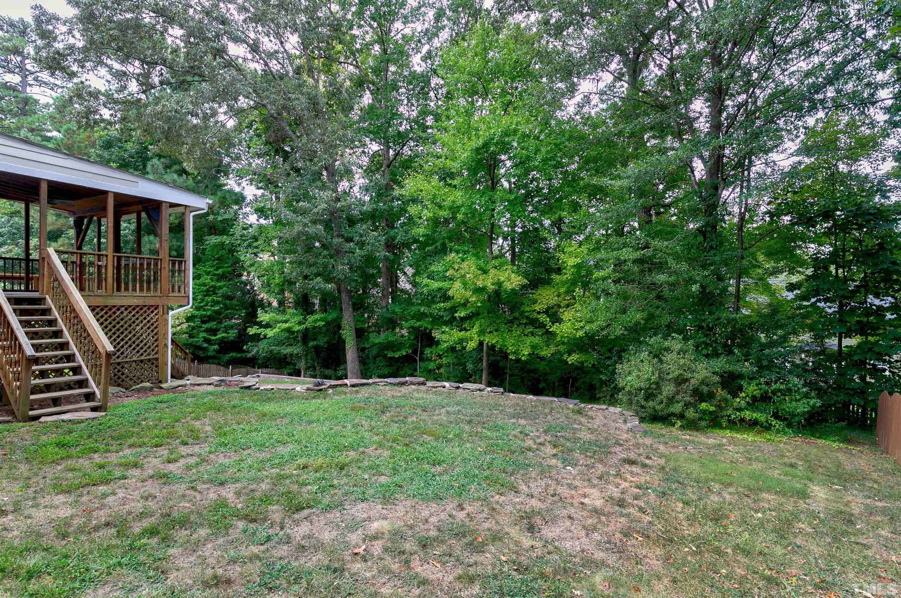 117 Trailing Oak Cary, NC 27513 - Photo 29 of 32 a backyard of a house with lots of green space