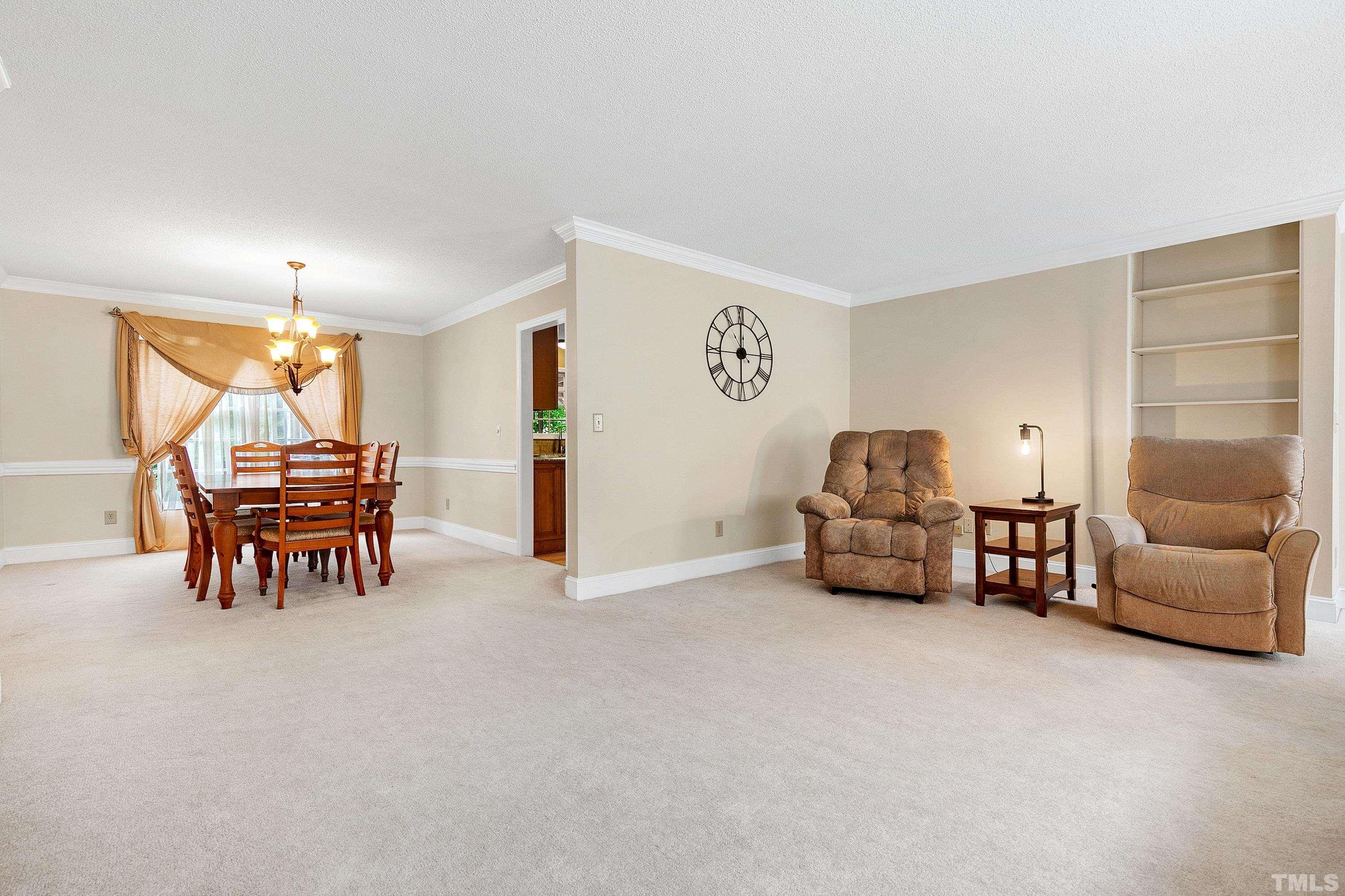117 Trailing Oak Cary, NC 27513 - Photo 4 of 32 a living room with furniture and a table