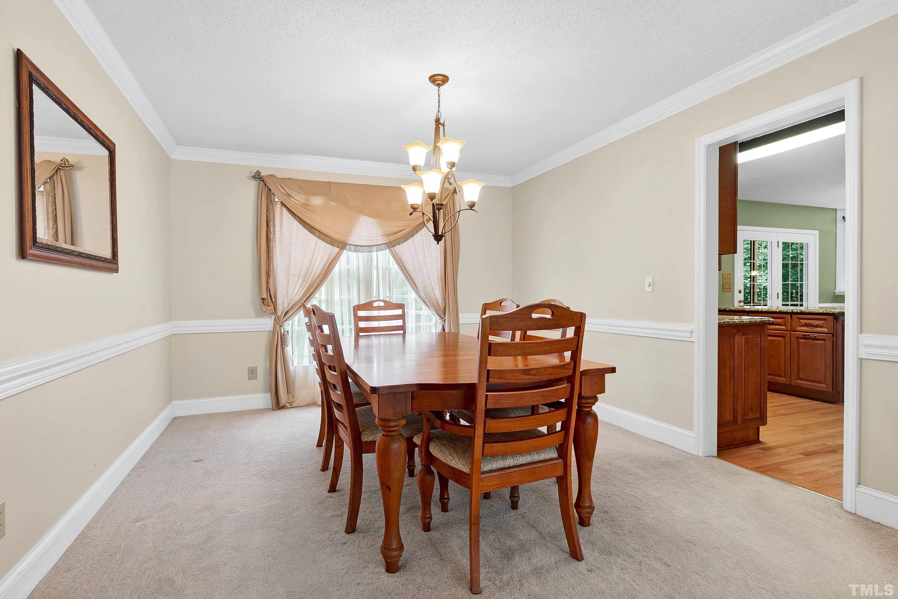 117 Trailing Oak Cary, NC 27513 - Photo 5 of 32 a dining room with furniture and window
