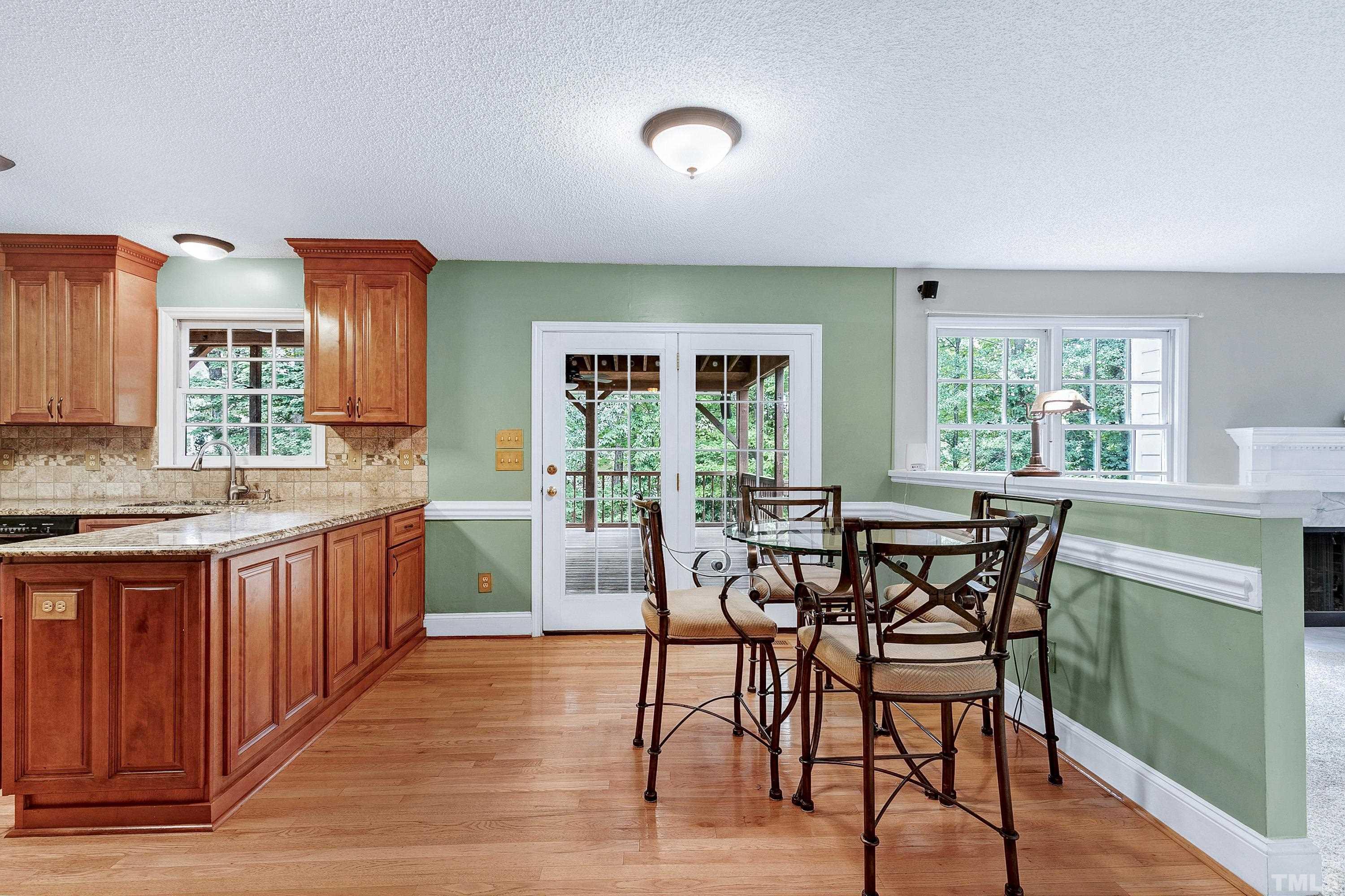 117 Trailing Oak Cary, NC 27513 - Photo 9 of 32 a view of a dining room with furniture window and wooden floor