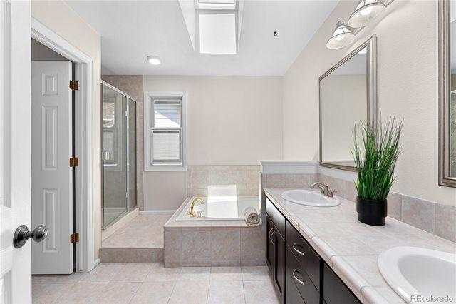 a bedroom with a bed a lamp and a window