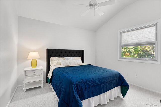 a bedroom with a bed and a chair