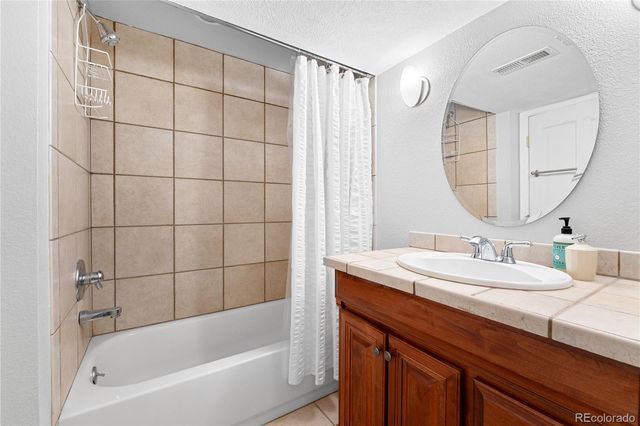 a view of balcony with a glass door and furniture