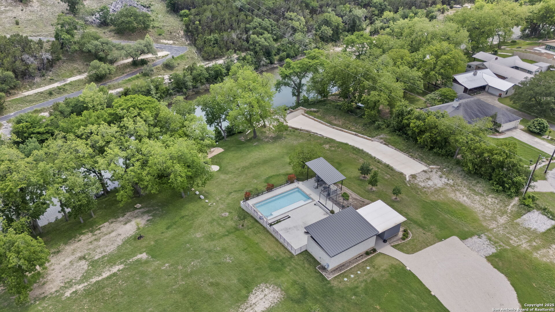 831 Wade Road New Braunfels, TX 78132 - Photo 22 of 35 an aerial view of a house with a garden