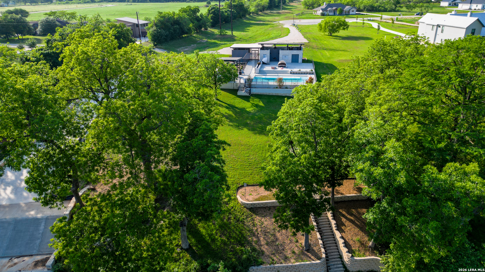 831 Wade Road New Braunfels, TX 78132 - Photo 24 of 35 a view of a lake with a house