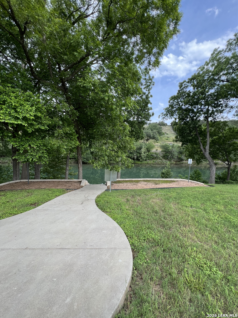 831 Wade Road New Braunfels, TX 78132 - Photo 25 of 35 a view of a garden and basketball court