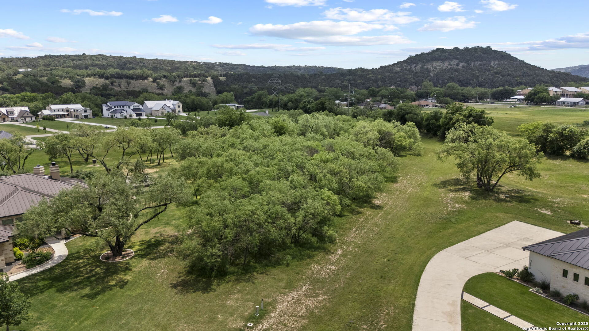 831 Wade Road New Braunfels, TX 78132 - Photo 7 of 35 a view of a lake with a mountain