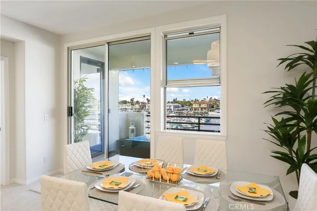 a kitchen with a sink cabinets and chairs
