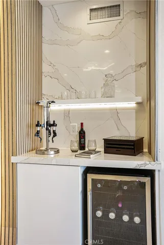 a bathroom with a tub a double vanity sink and mirror