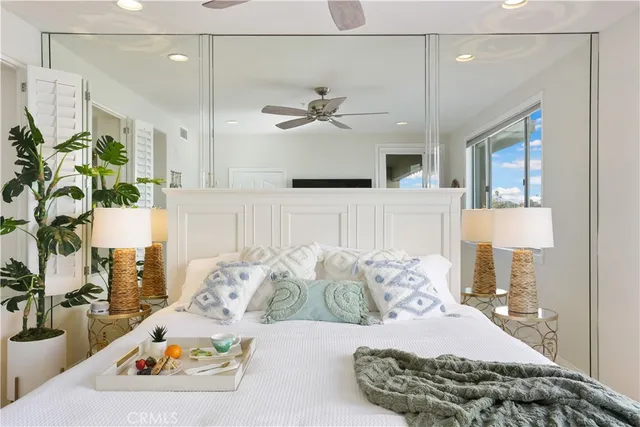 a balcony with furniture and a floor to ceiling window