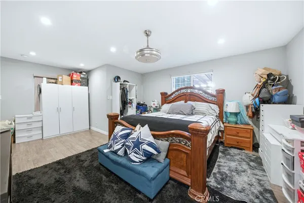 a bedroom with furniture and a chandelier