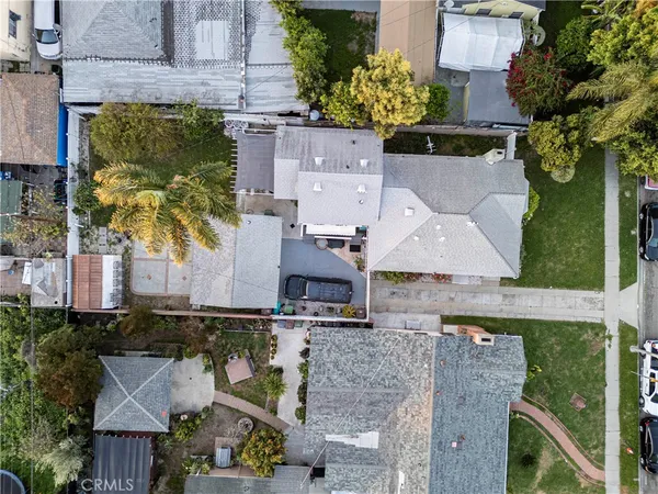 an aerial view of a house with a swimming pool