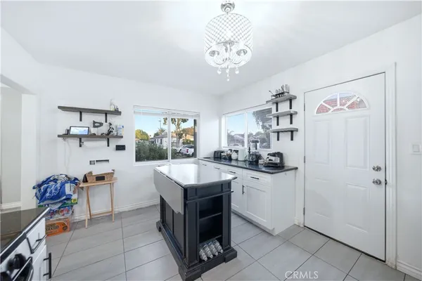 a kitchen that has a lot of cabinets in it