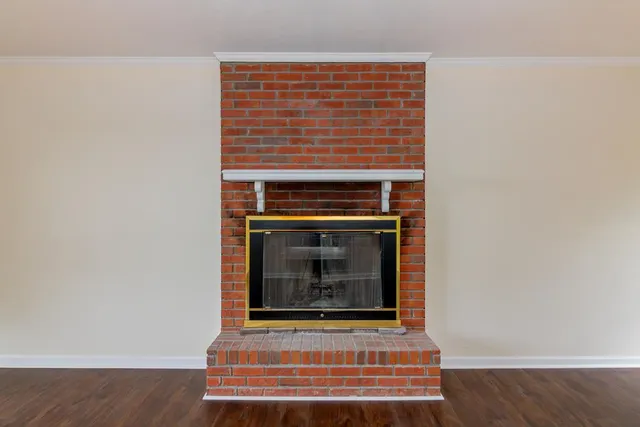 an empty room with a ceiling fan and a window