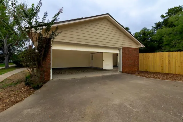 an empty room with a empty space and a window