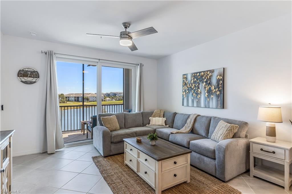 43989 Boardwalk Loop, Unit 2025 Babcock Ranch, FL 33982 - Photo 3 of 14 a living room with furniture and a large window
