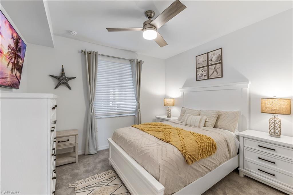 43989 Boardwalk Loop, Unit 2025 Babcock Ranch, FL 33982 - Photo 8 of 14 a bedroom with a bed and a window