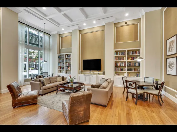 a view of a dining room with furniture and a potted plant