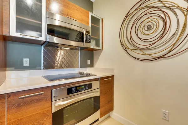 a kitchen with a stove and a microwave