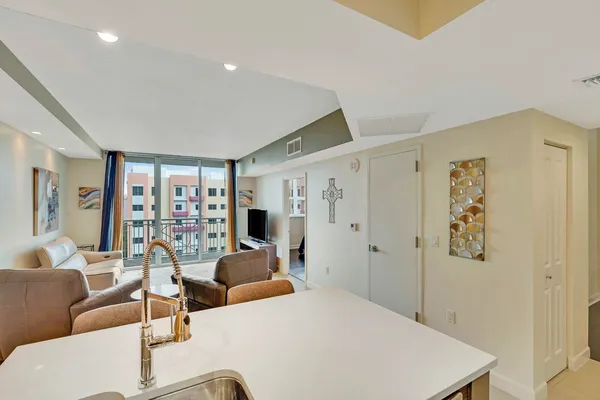 a living room with furniture and large window