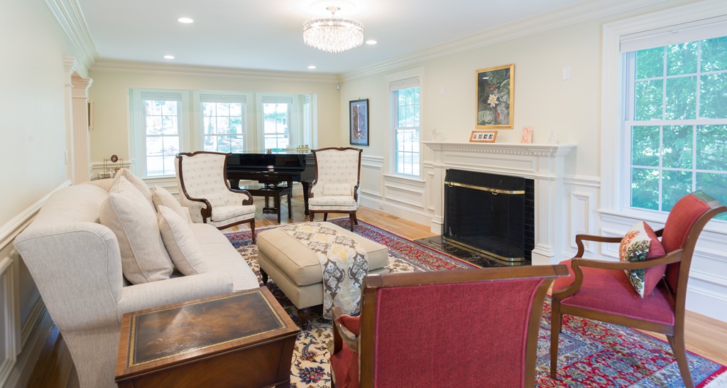 139 Arnold Road Newton, MA 02459 - Photo 11 of 30 a living room with furniture a fireplace and a table