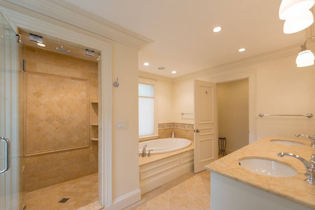 139 Arnold Road Newton, MA 02459 - Photo 18 of 30 a bathroom with a granite countertop sink mirror vanity and toilet