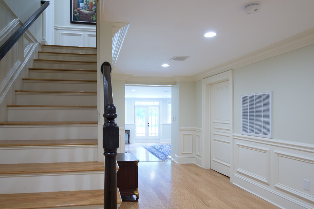 139 Arnold Road Newton, MA 02459 - Photo 23 of 30 a view of entryway with wooden floor and stairs