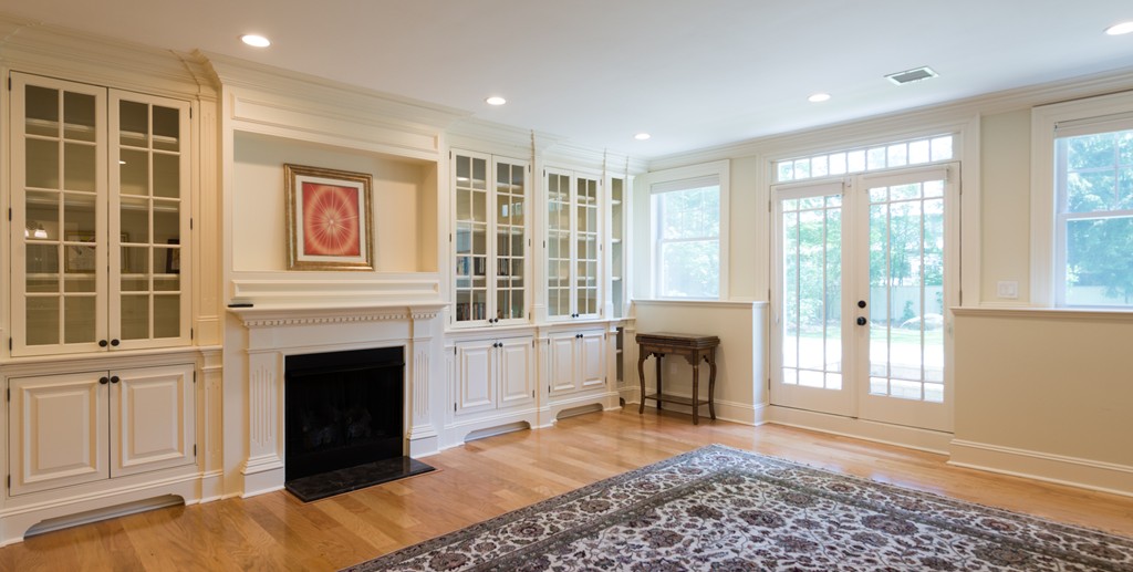 139 Arnold Road Newton, MA 02459 - Photo 24 of 30 a living room with furniture and a fireplace