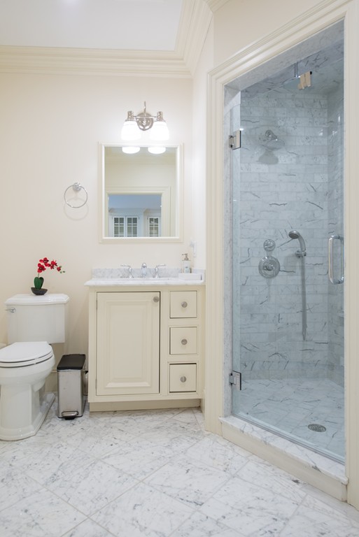 139 Arnold Road Newton, MA 02459 - Photo 26 of 30 a bathroom with a granite countertop sink mirror and toilet