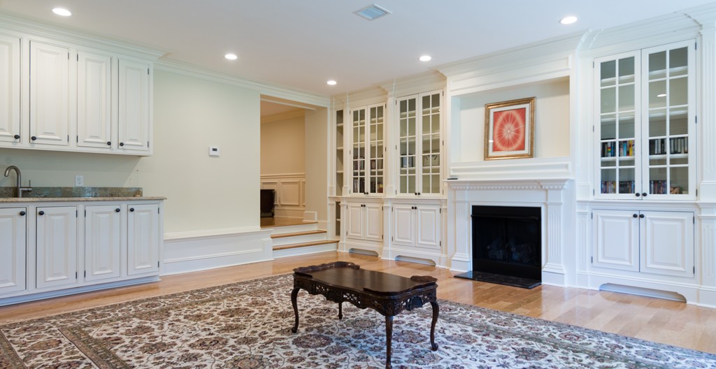 139 Arnold Road Newton, MA 02459 - Photo 27 of 30 a living room with furniture and a fireplace