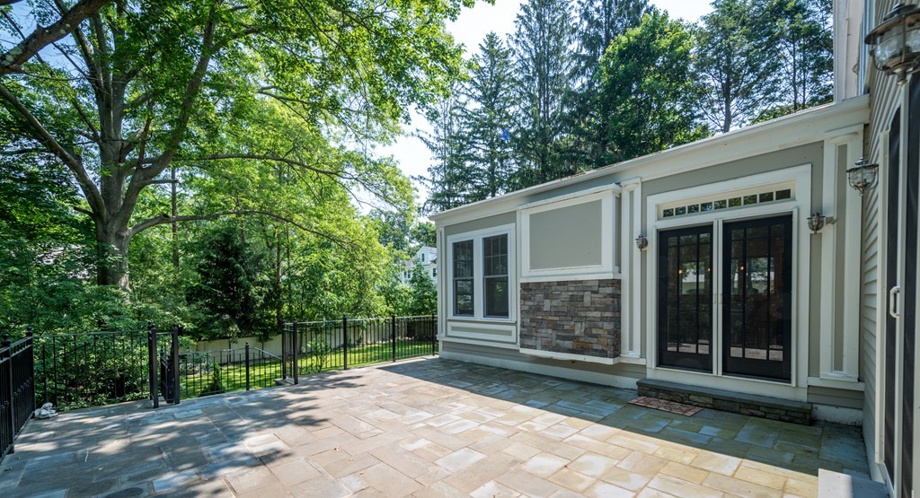 139 Arnold Road Newton, MA 02459 - Photo 29 of 30 a view of house with backyard outdoor space and garden
