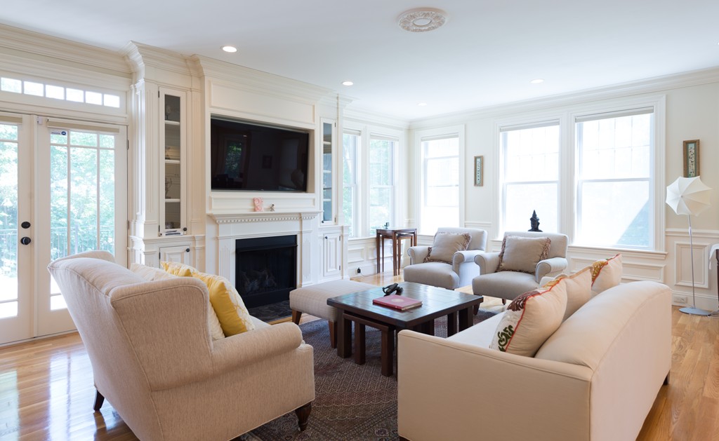 139 Arnold Road Newton, MA 02459 - Photo 6 of 30 a living room with furniture a fireplace and a flat screen tv