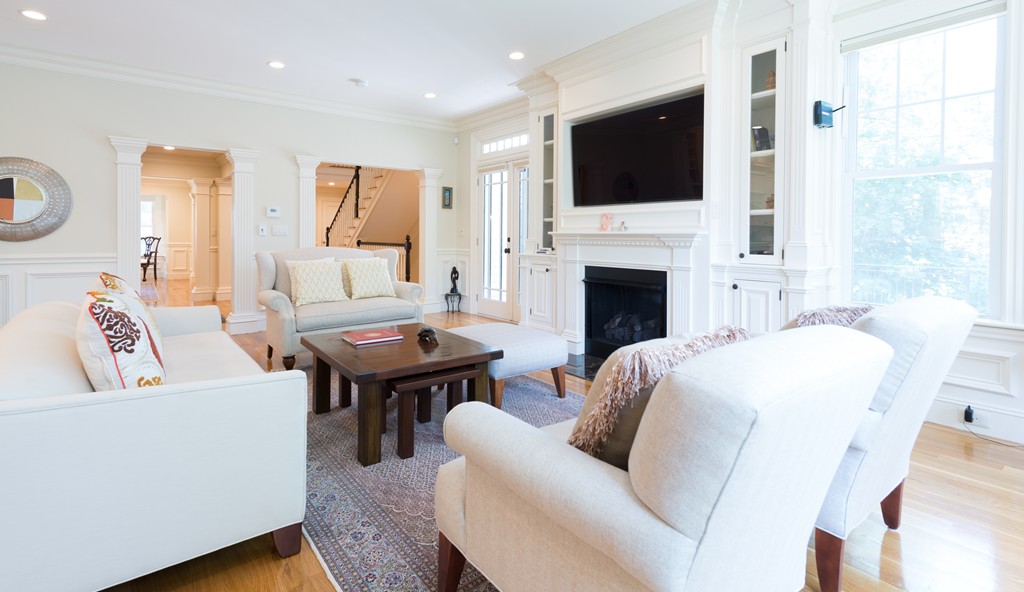 139 Arnold Road Newton, MA 02459 - Photo 8 of 30 a living room with fireplace furniture and a flat screen tv