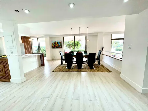 a view of a living room and kitchen view