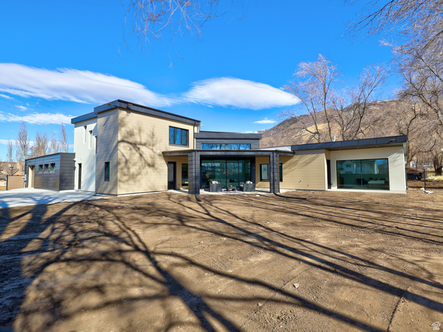 1306 East Victor Lane Draper, UT 84020 - Photo 52 of 60 View of front of house featuring a patio area and an outbuilding