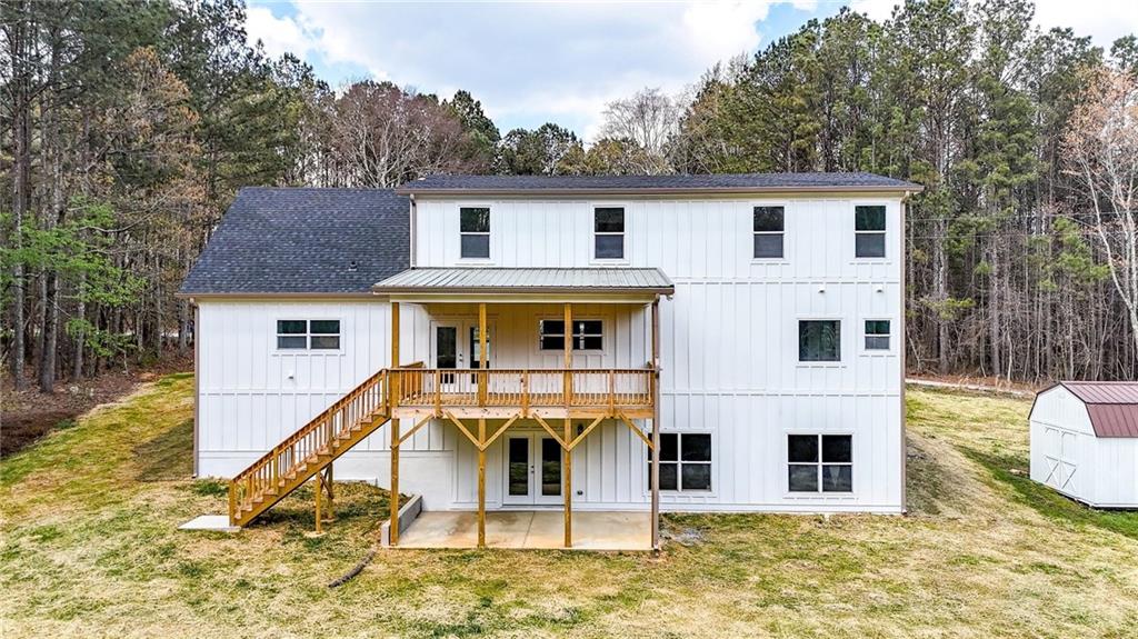 88 Carolyn Path Rockmart, GA 30153 - Photo 65 of 73 a view of a white house with wooden fence and a small yard