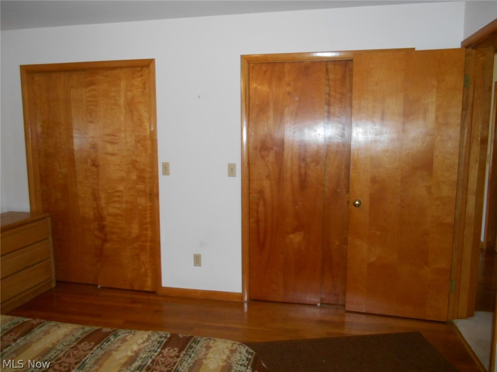 3206 Lake Road West Ashtabula, OH 44004 - Photo 20 of 25 MASTER BEDROOM, TWO LARGE CLOSETS, HARDWOOD FLOORS